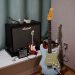 a guitar and amp sitting on a table