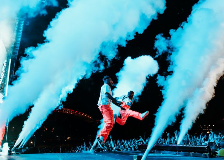 two person performing on stage