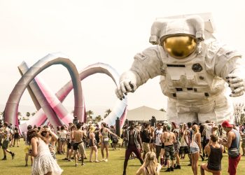 group of person standing on green grass field