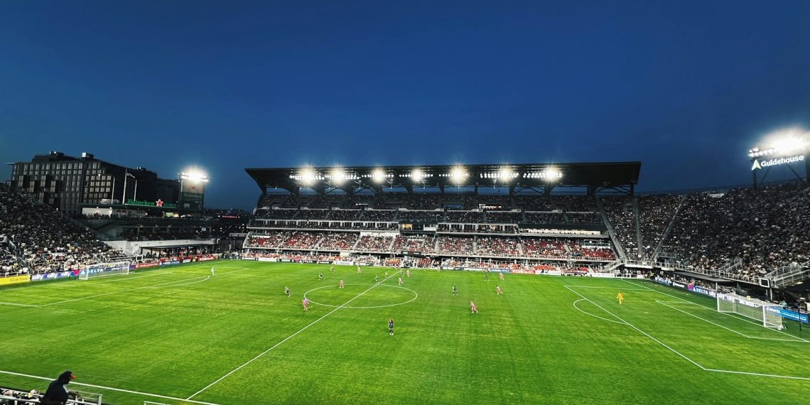 A soccer stadium filled with lots of people