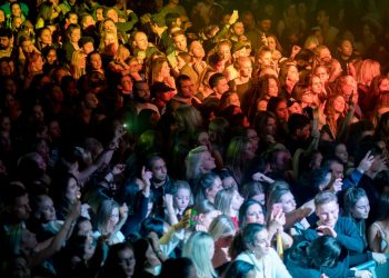 people standing near stage