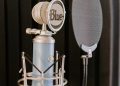 silver and black microphone on black and silver microphone stand