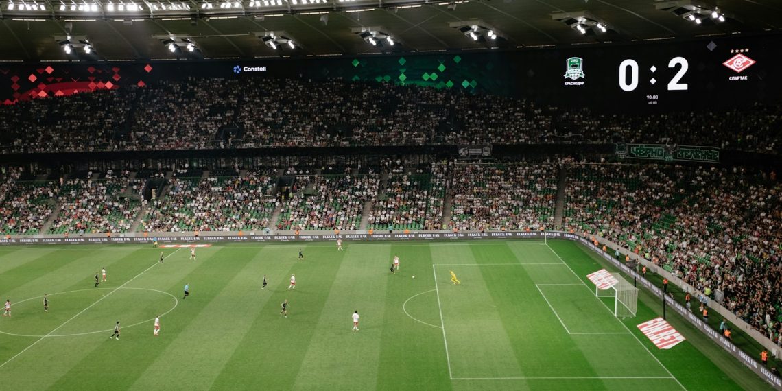 a soccer field with a lot of people on it