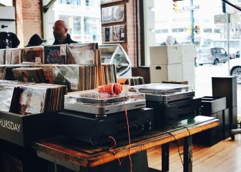 red headphones on gray turntable