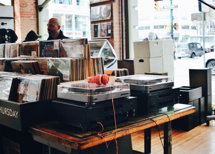 red headphones on gray turntable