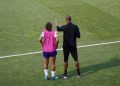 man and woman standing on field