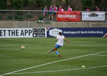 person playing soccer on field