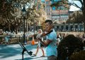 man playing violin at the park